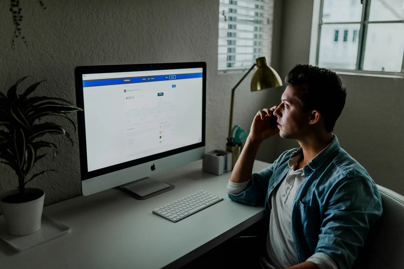 Founder reviewing Shopify store performance and conversion dashboard on a monitor
