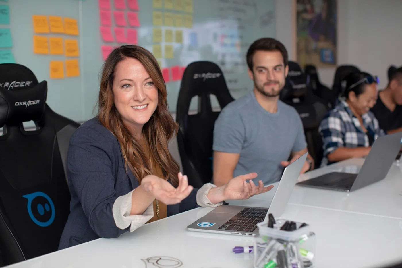 Designer and teammate seated together reviewing a usability testing session on screen
