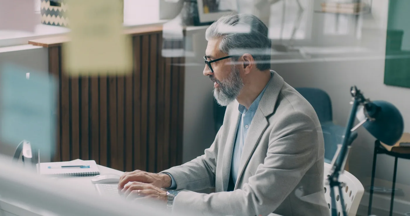 Strategist mapping YouTube niche and channel positioning on a laptop